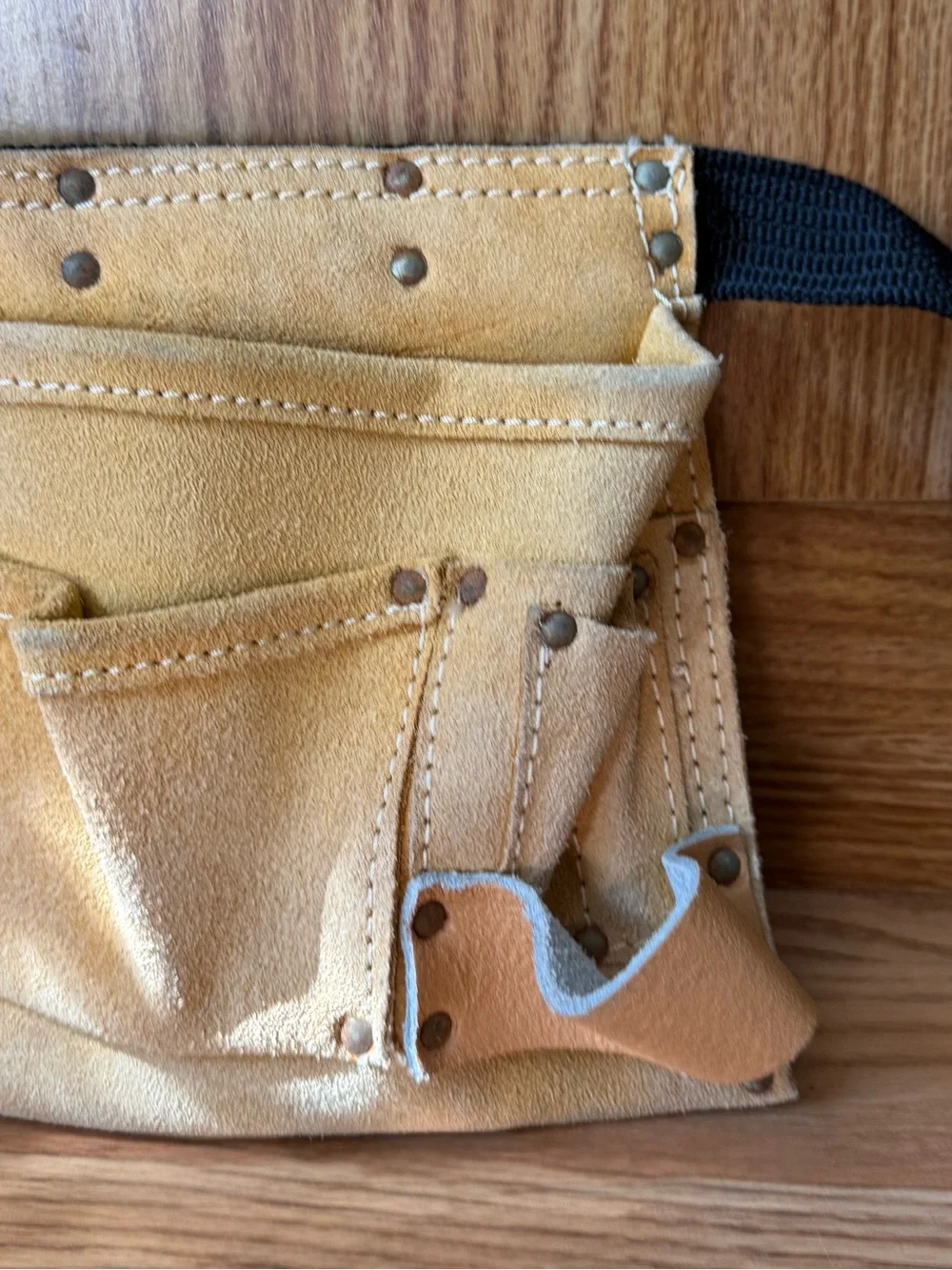 Suede leather Tool-belt that says ”Daddy Helper”n large gold letters in front.